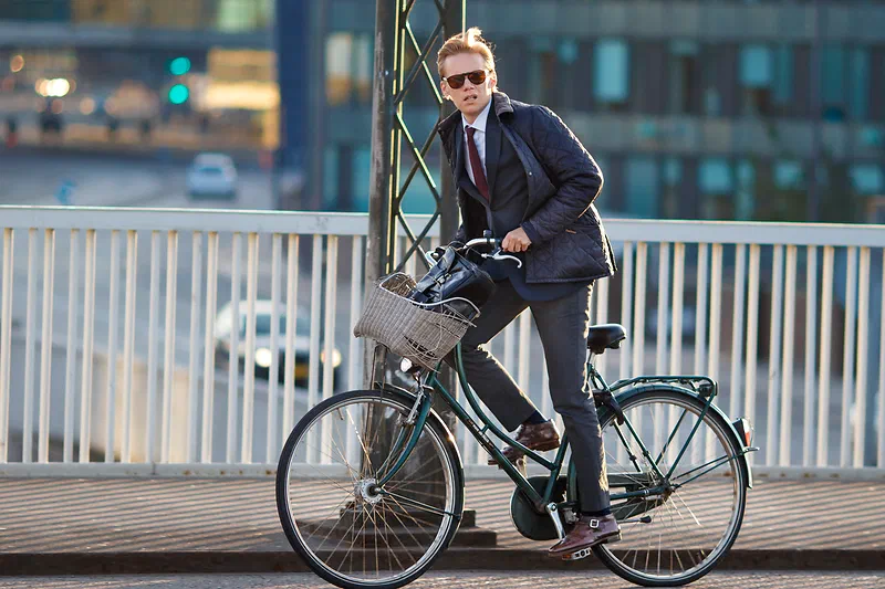 A classy guy biking at Knippels Bro, Copenhagen, Denmark. Taken with Canon 80D + Canon EF 135mm f/2L USM.
