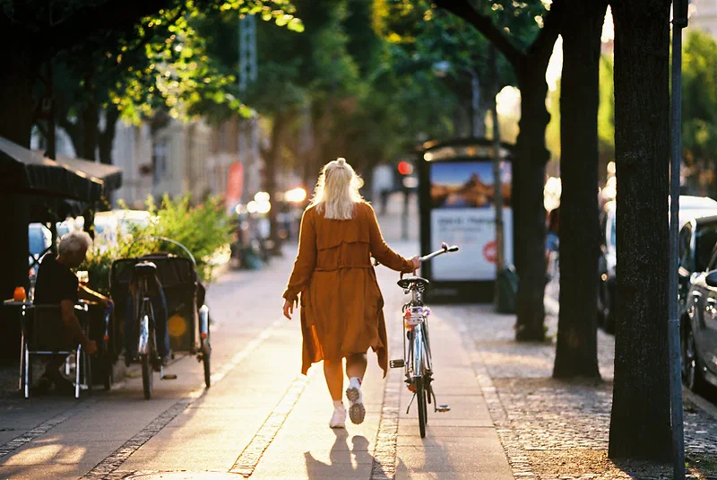 Girl walking on Frederiksberg Allé on a summer day. Shot with Canon EOS 650 + Canon EF 135mm f2 + Kodak Ektar 100.