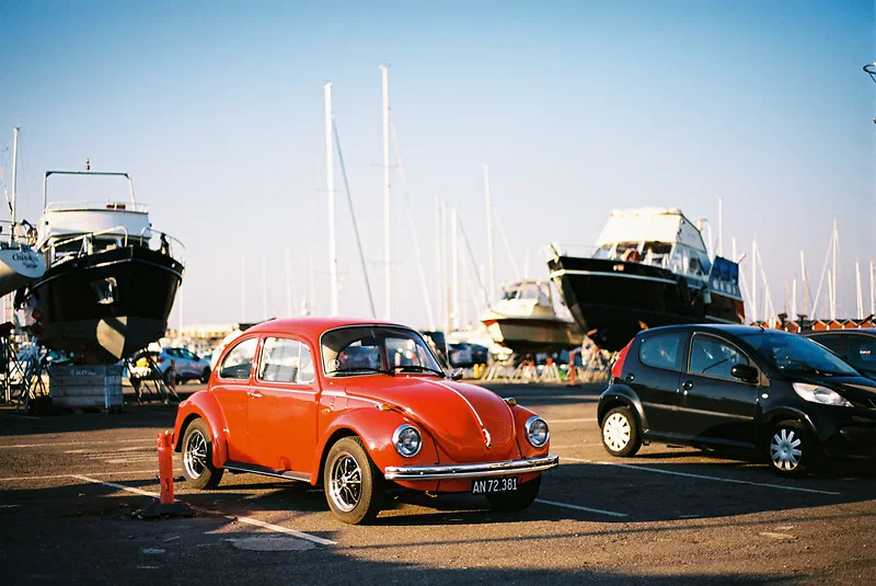 Volkswagen Beetle in Helsingør Harbor, Denmark. Shot with Canon EOS 650 + Canon EF 50mm f1.4 + Kodak Ektar 100. Good example how Kodak Ektar boost red and blue colors.