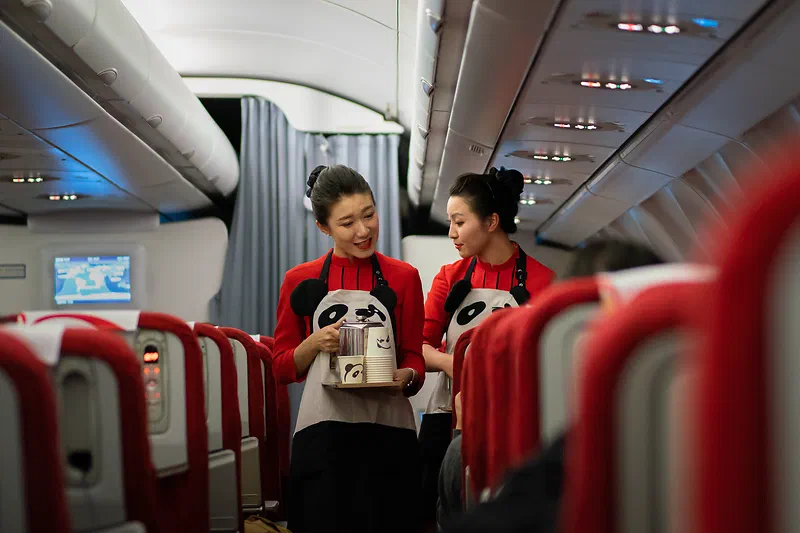 Sichuan Airlines flight attendants. Shot with the Sony FE 55mm F1.8 ZA. I love the reds from the sensor and the “Autumn leaves” creative style.