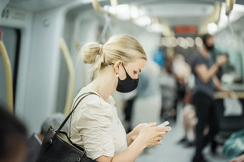Girl wearing face mask in Copenhagen Metro, shot with the Tamron SP 85mm F/1.8 Di VC USD on Silbersaltz 500T. Was shot at f1.8 at 1/30 iso400 in a fast moving metro train, that’s why it’s not tack sharp.