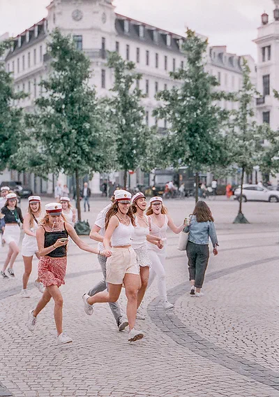 Danish high school students at Kongens Nytorv, shot with Cinestill 800 with the Tamron SP 85mm F/1.8 Di VC USD