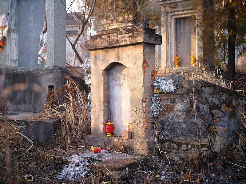 Graveyard in Yunxi, China. During Chinese New Year people go to their families graves and to pray and light candlelight’s, something that was very interesting to experience.