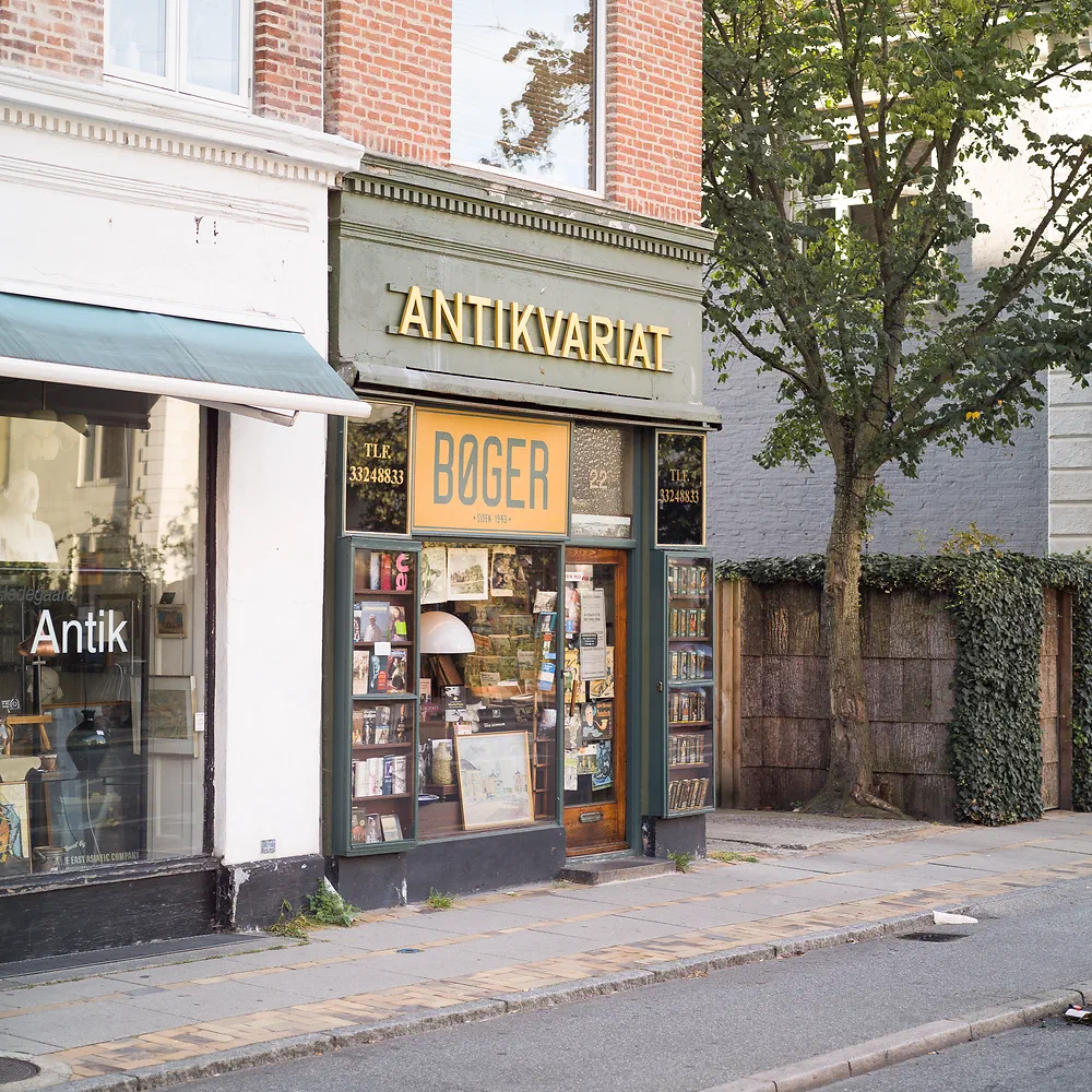 Old antique book shop with a BØGER sign on a Frederiksberg street